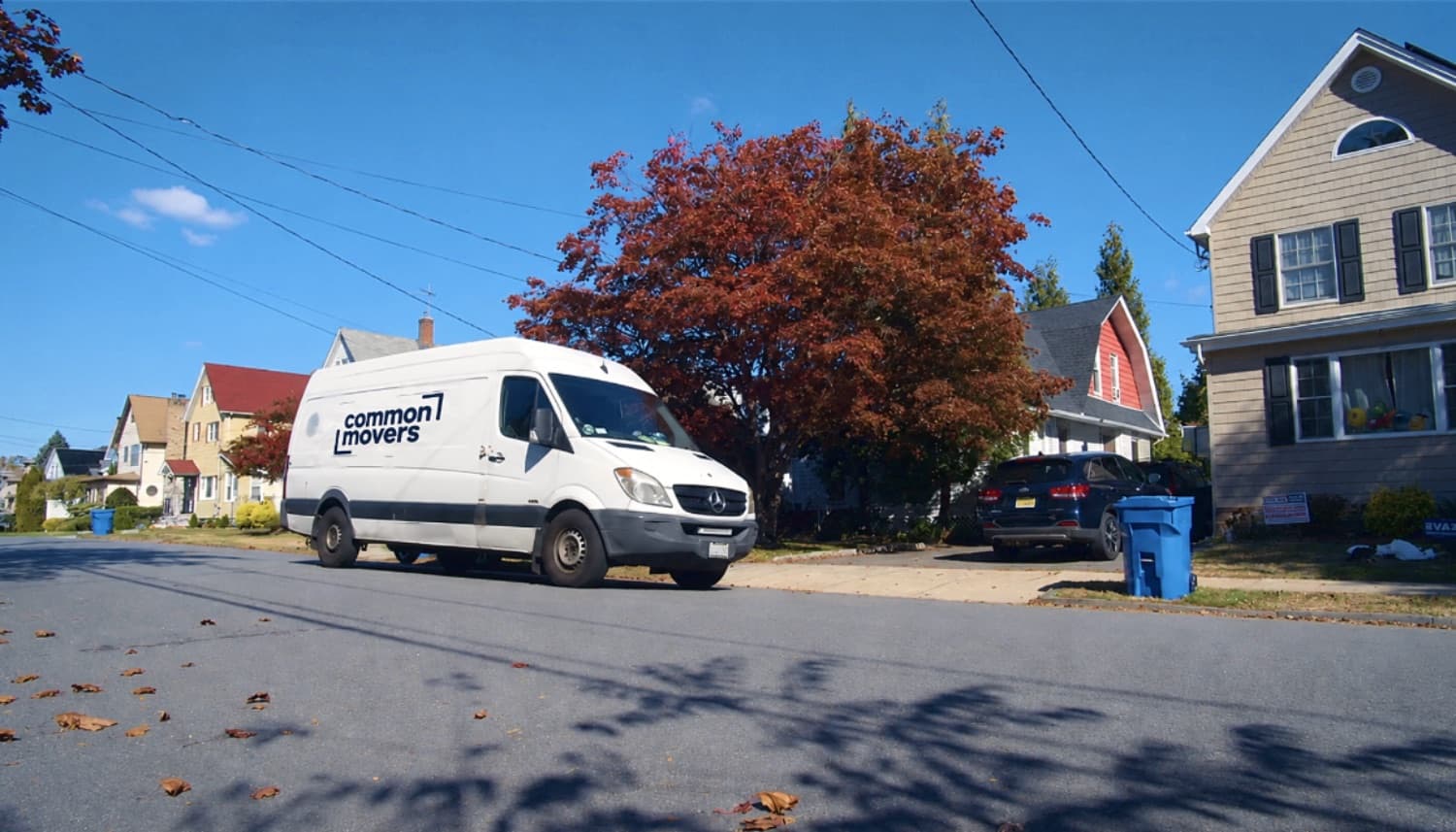 A Common Movers van parked on a residential street